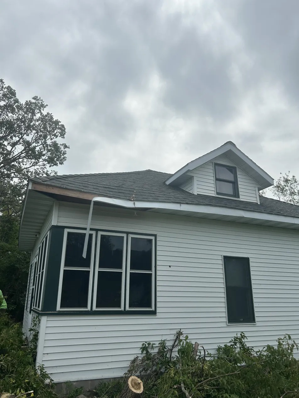 Large pine crushing house roof